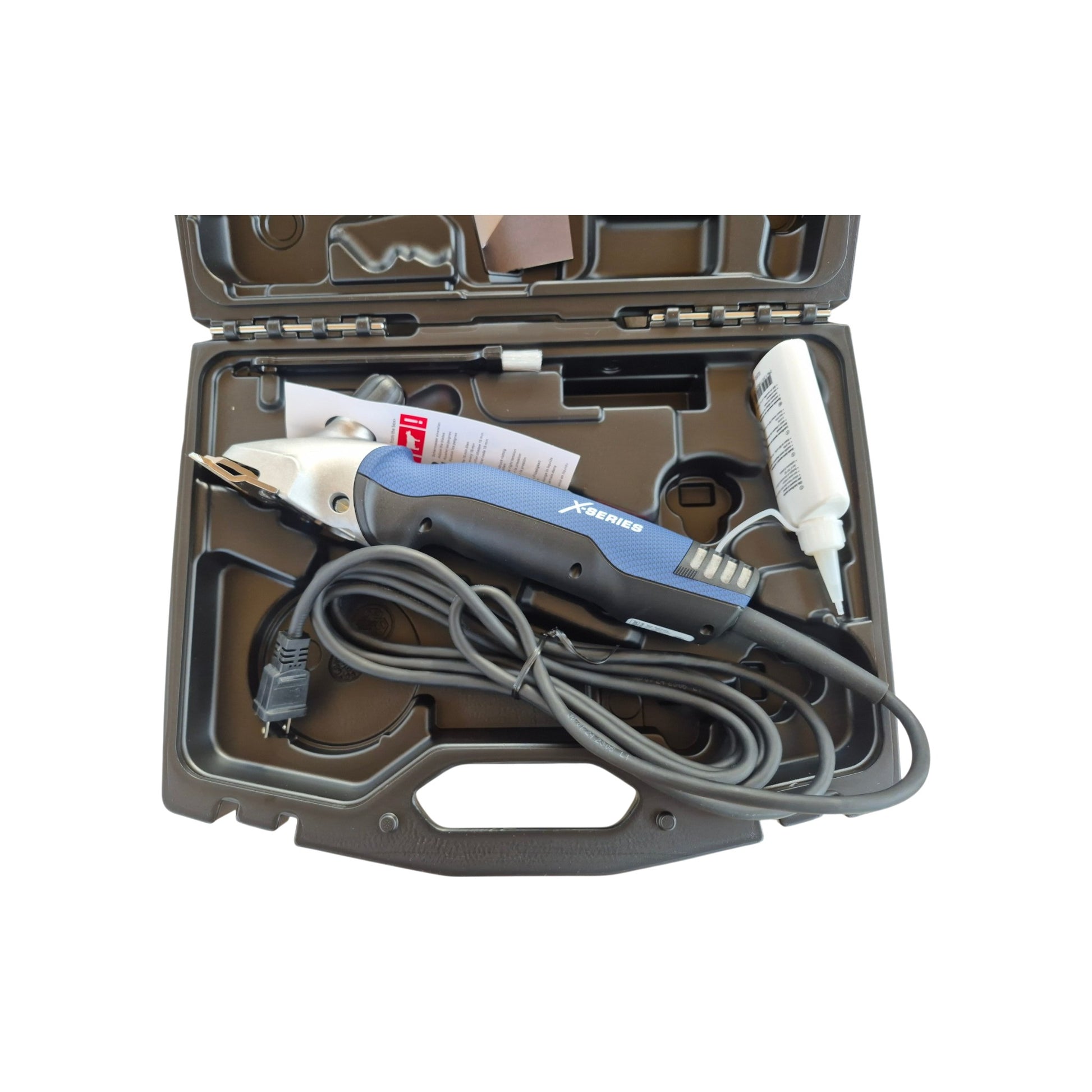Heiniger Xperience Professional Corded Horse & Cattle Clipper complete kit with blade set, carrying case, oil, cleaning brush, screwdriver, and instruction manual.